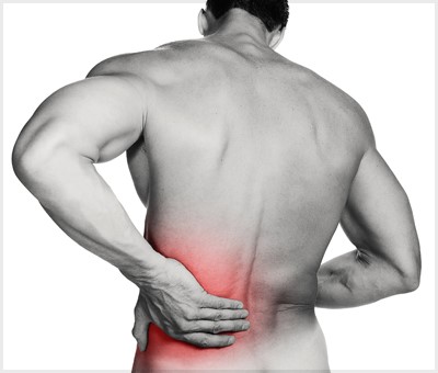 How do we treat spasmed low back muscles with manual therapy?